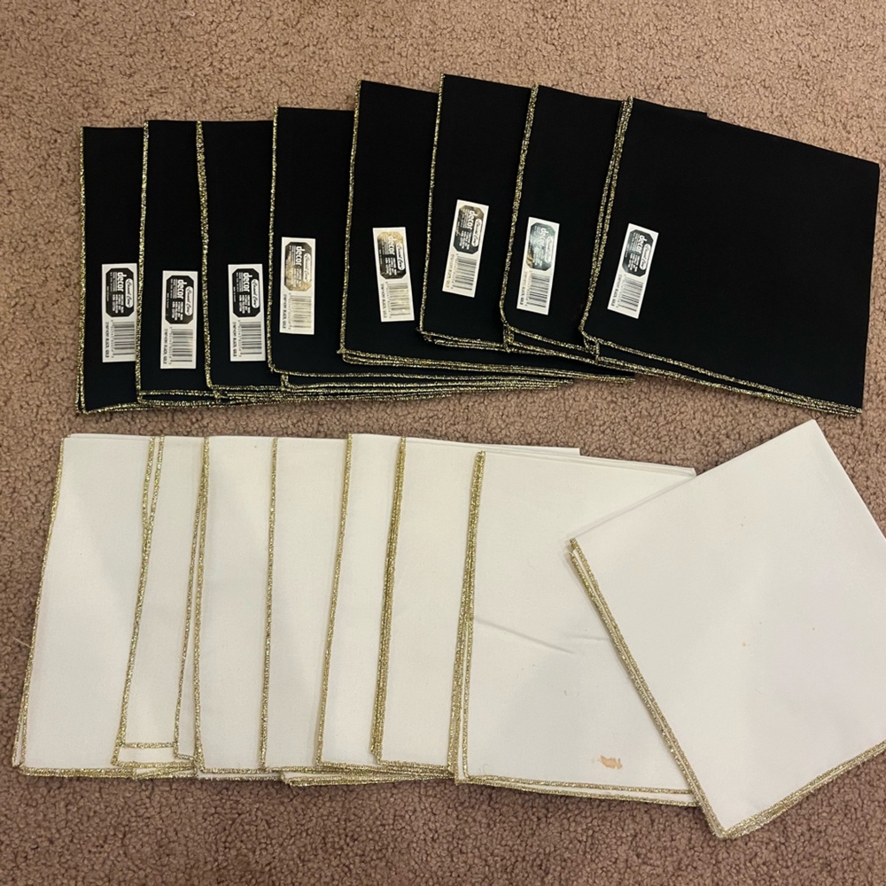 Set of 16 Holiday Fabric napkins 8 Black w/ Gold trim and 8 White w/Gold trim.